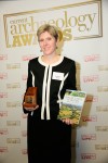 Rebecca Jones, with her award-winning book and prize, as the winner of 2013's Book of the Year at the prestigious Current Archaeology Awards