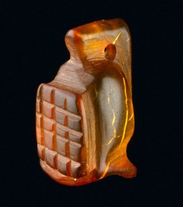Amber amulet in the shape of a gladiator’s helmet. Amber was an expensive imported material and was thought to have magical powers. The Roman author Pliny describes how amber amulets could protect children from illness and the symbolism of the gladiator may also be protective  Image: MOLA